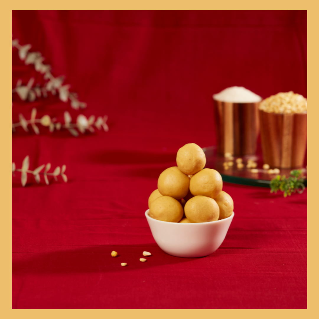 Malu's traditional sweet round laddoos in white bowl on red cloth to buy maa ladoo online