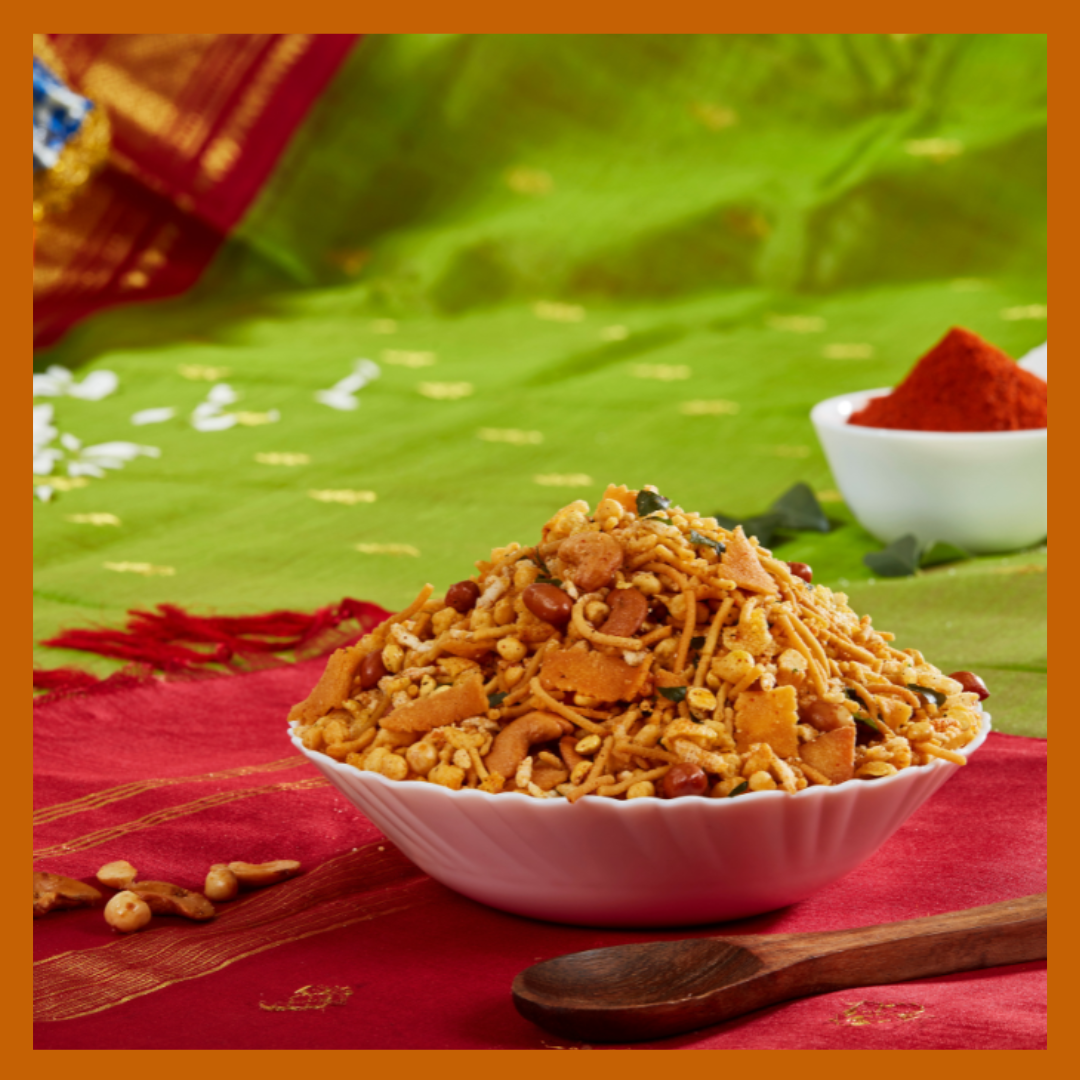 Traditional Madras mixture online 180g served in a white bowl with spices on a green and red cloth background