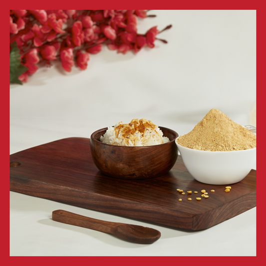 Wooden bowls with South Indian Paruppu Podi spice powder and rice on a wooden board buy South Indian Paruppu Podi