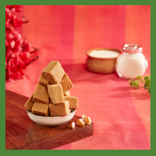 Malu's traditional South Indian Delicacies stacked in a bowl on a wooden board with vibrant red background