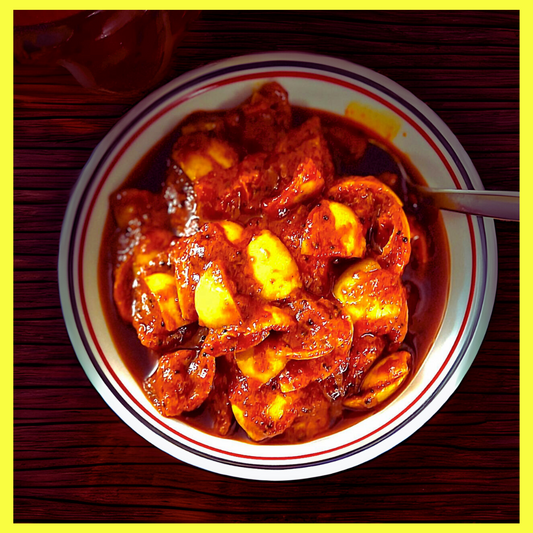 Malu's South Indian lemon pickle served in a bowl with rich, spicy seasoning