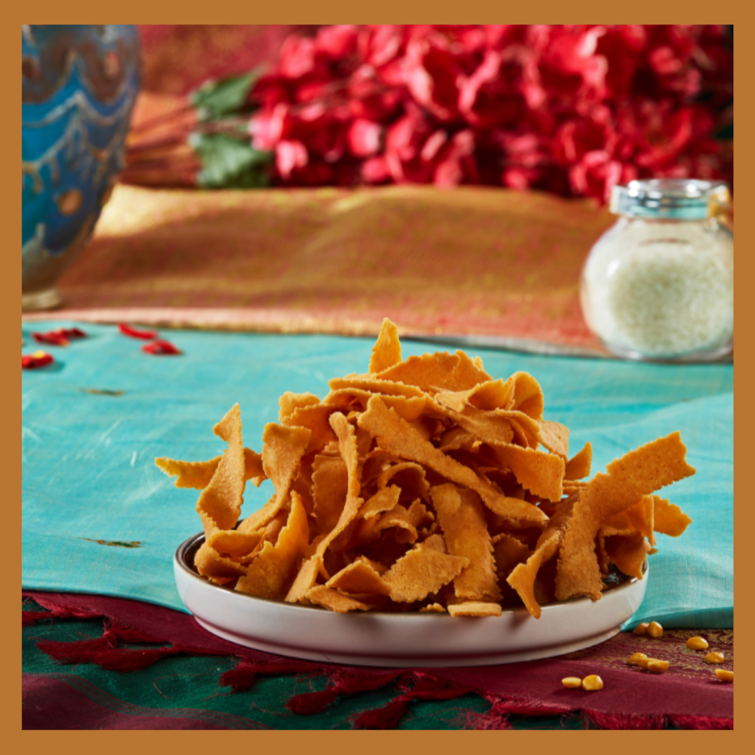 Malu's South Indian Ribbon Pakoda snacks served on white plate with colorful background
