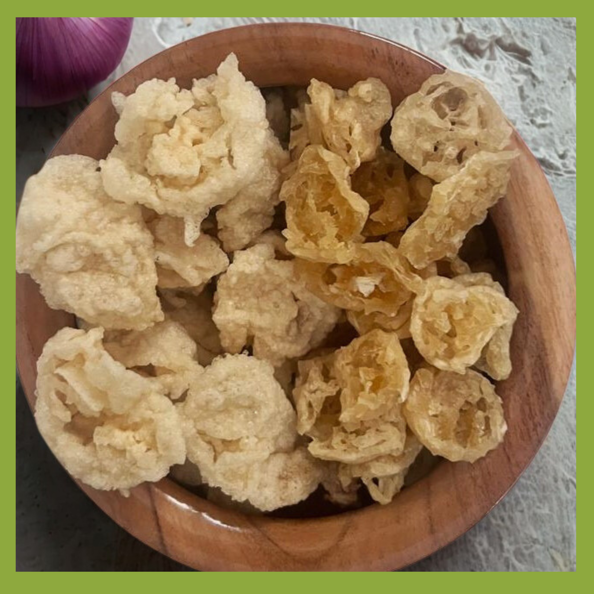 Malu's Vengaya onion vadam online crispy snacks served in a wooden bowl